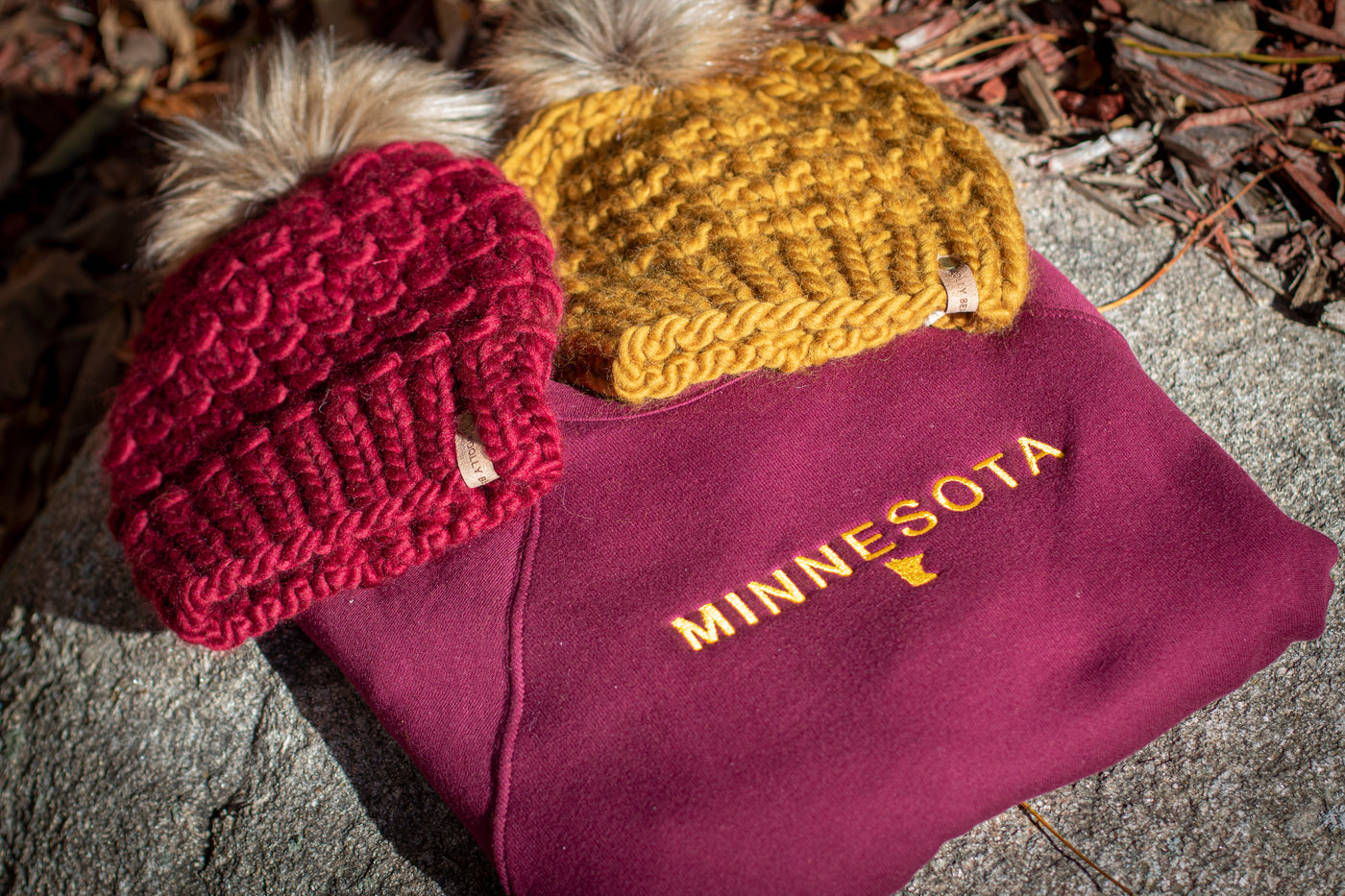 Minnesota maroon sweatshirt with maroon and gold hats